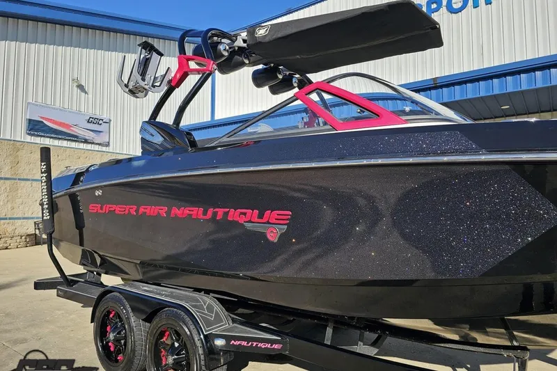 Slide: The Image of 2015 Nautique Super Air Nautique G23 boat with sparkling black finish and red accents. - 10