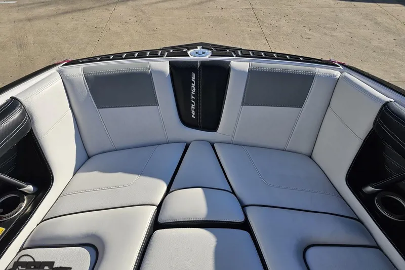 Slide: The Image of 2015 Nautique Super Air Nautique G23 boat interior with white and black seating. - 102