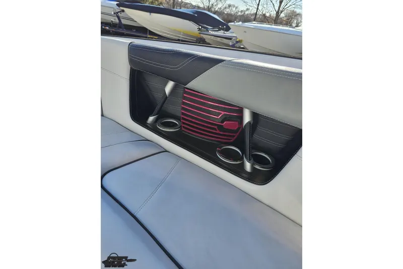 Slide: The Image of 2015 Nautique Super Air Nautique G23 interior with cup holders and stylish seating. - 103
