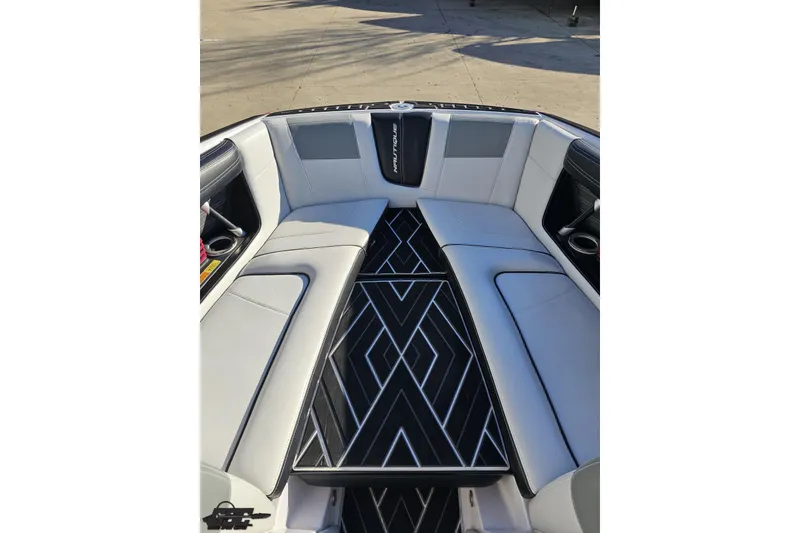 Slide: The Image of 2015 Nautique Super Air Nautique G23 boat interior with stylish seating and geometric flooring. - 106