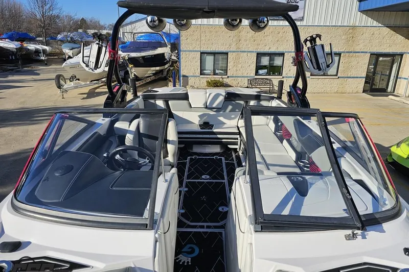 Slide: The Image of 2015 Nautique Super Air Nautique G23 boat interior with open cockpit and seating. - 107