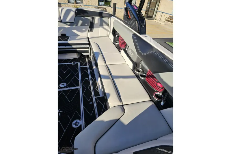 Slide: The Image of 2015 Nautique Super Air Nautique G23 interior with sleek seating and modern design elements. - 110