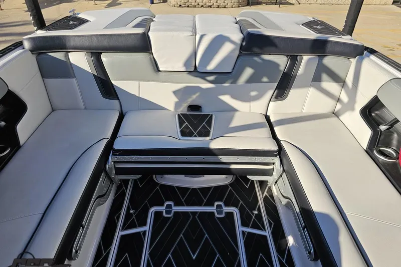Slide: The Image of Luxurious interior of 2015 Nautique Super Air Nautique G23 boat with sleek seating design. - 115