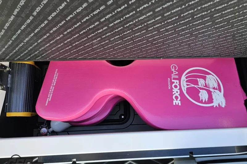 Slide: The Image of Storage compartment of 2015 Nautique Super Air Nautique G23 with pink Galforce float. - 118