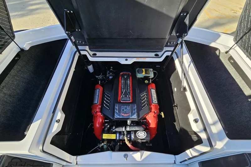 Slide: The Image of 2015 Nautique Super Air Nautique G23 engine compartment with PCM engine visible. - 126