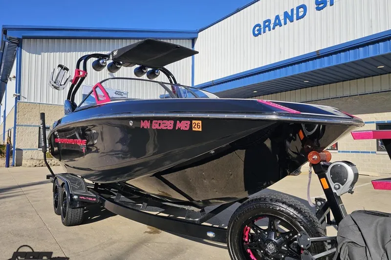 Slide: The Image of 2015 Nautique Super Air Nautique G23 boat on trailer outside Grand Sport Center. - 18