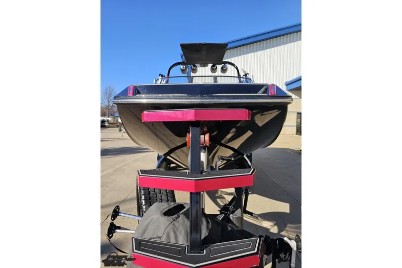 Slide: The Image of 2015 Nautique Super Air Nautique G23 boat on trailer, rear view, outdoors. - 19