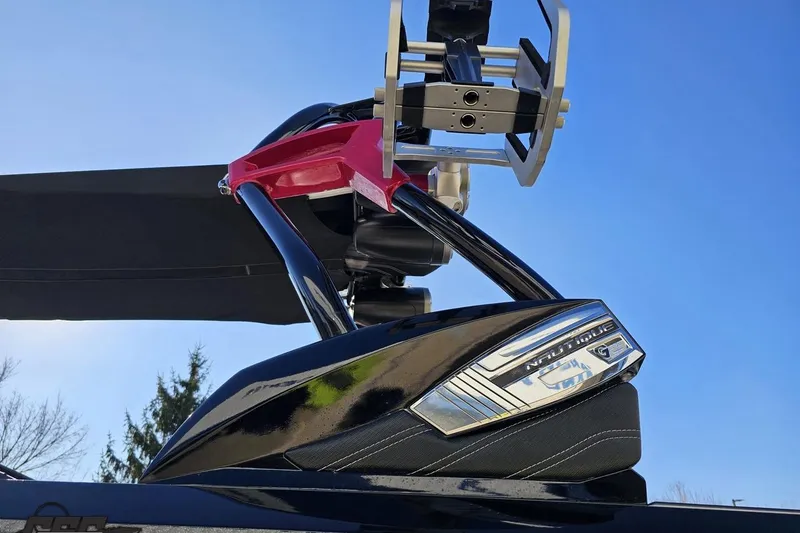 Slide: The Image of 2015 Nautique Super Air Nautique G23 wakeboard tower against clear blue sky. - 30