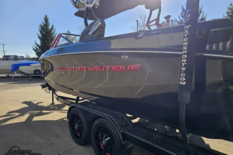Slide: The Image of 2015 Nautique Super Air Nautique G23 boat on trailer, side view in sunlight. - 32