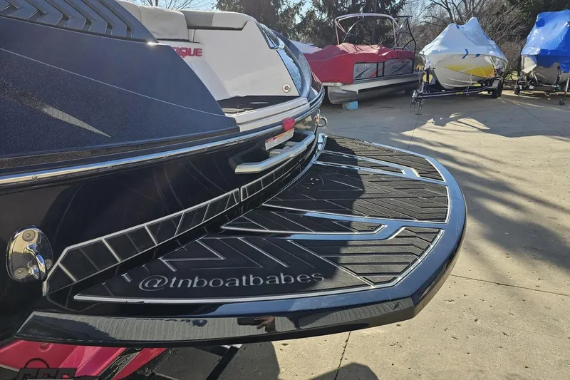 Slide: The Image of 2015 Nautique Super Air Nautique G23 boat rear view with swim platform. - 34