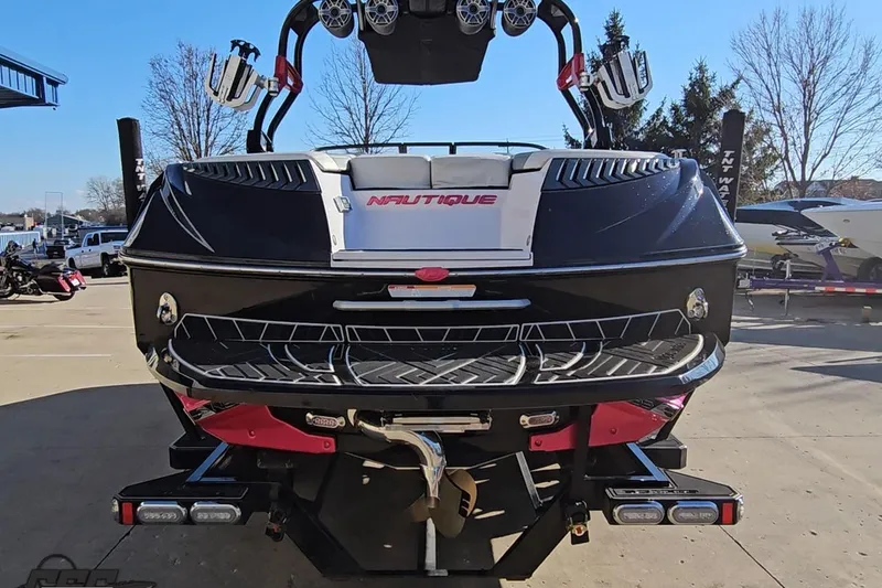 Slide: The Image of 2015 Nautique Super Air Nautique G23 boat rear view with wakeboard tower. - 35