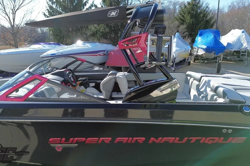 Slide: The Image of 2015 Nautique Super Air Nautique G23 boat with sleek design and vibrant accents. - 50
