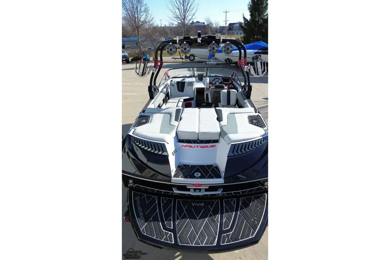 Slide: The Image of 2015 Nautique Super Air Nautique G23 boat with sleek design and spacious seating. - 53