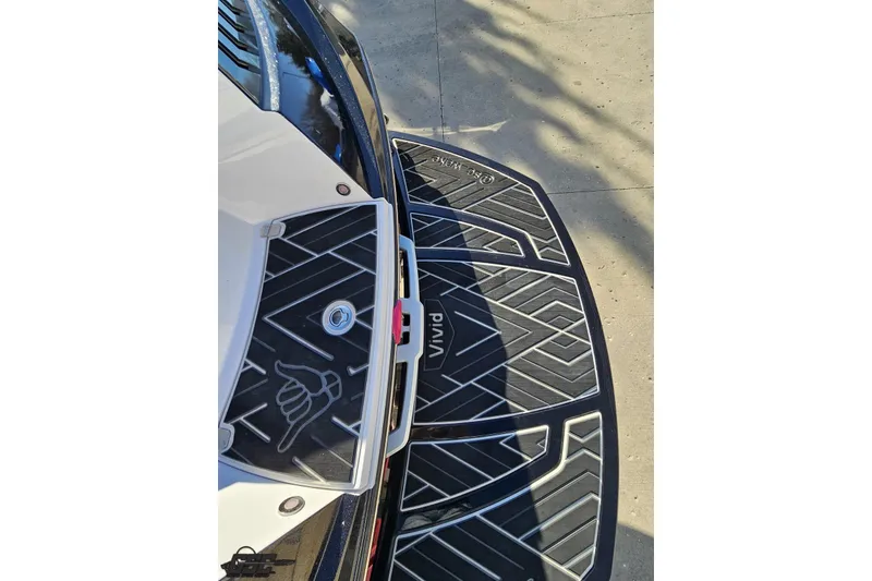 Slide: The Image of 2015 Nautique Super Air Nautique G23 boat deck with custom black and white design. - 54