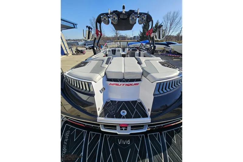 Slide: The Image of 2015 Nautique Super Air Nautique G23 boat with sleek design and modern features. - 55