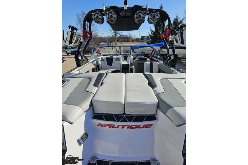 Slide: The Image of 2015 Nautique Super Air Nautique G23 boat interior with premium seating and sound system. - 56