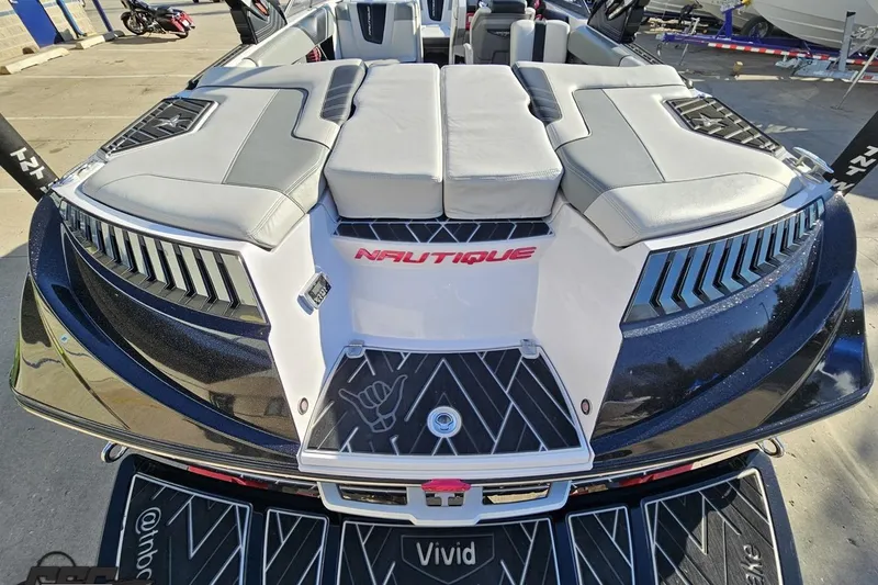 Slide: The Image of 2015 Nautique Super Air Nautique G23 boat with sleek design and comfortable seating. - 57