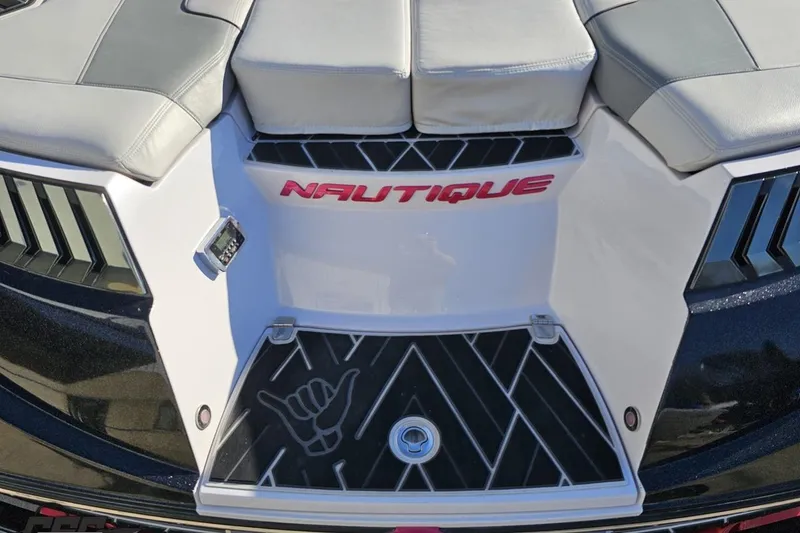Slide: The Image of 2015 Nautique Super Air Nautique G23 boat rear deck with logo and seating. - 58