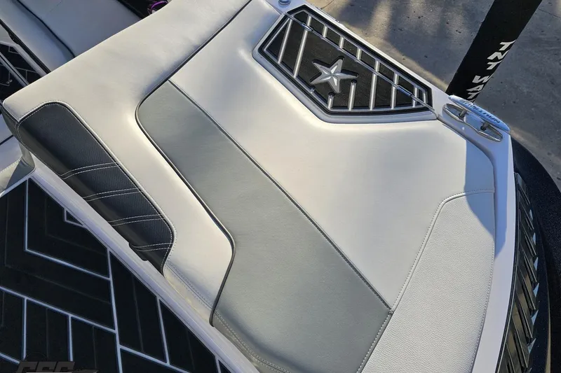 Slide: The Image of 2015 Nautique Super Air Nautique G23 boat seat with star emblem and sleek design. - 63