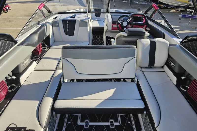Slide: The Image of Interior of 2015 Nautique Super Air Nautique G23 boat with luxurious seating. - 66