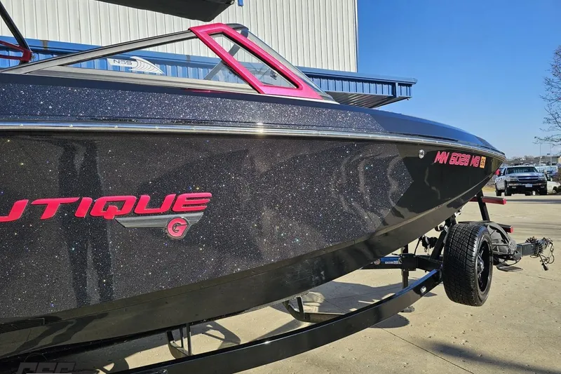Slide: The Image of 2015 Nautique Super Air Nautique G23 boat with sparkling black finish on a trailer. - 7