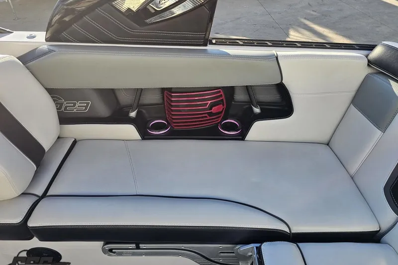 Slide: The Image of 2015 Nautique Super Air Nautique G23 interior seating with stylish design and cup holders. - 70