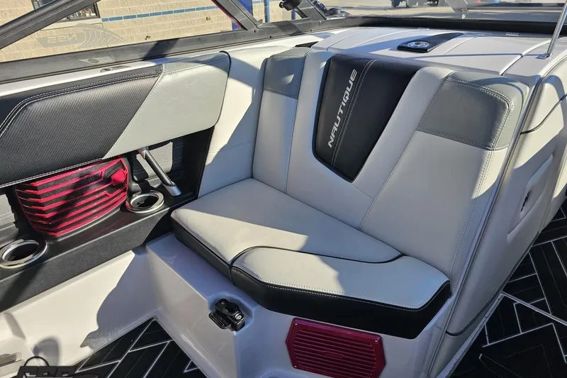 Slide: The Image of 2015 Nautique Super Air Nautique G23 interior with stylish seating and cup holders. - 78