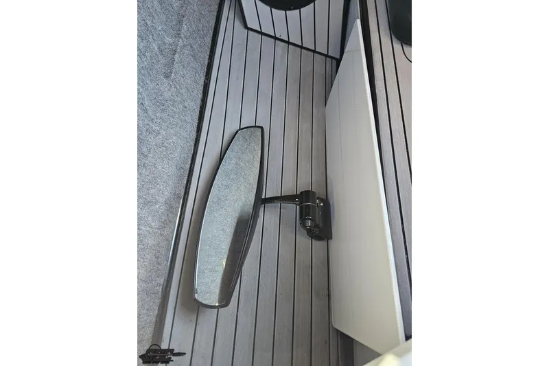 Slide: The Image of 2015 Nautique Super Air Nautique G23 interior with sleek flooring and mirror detail. - 80
