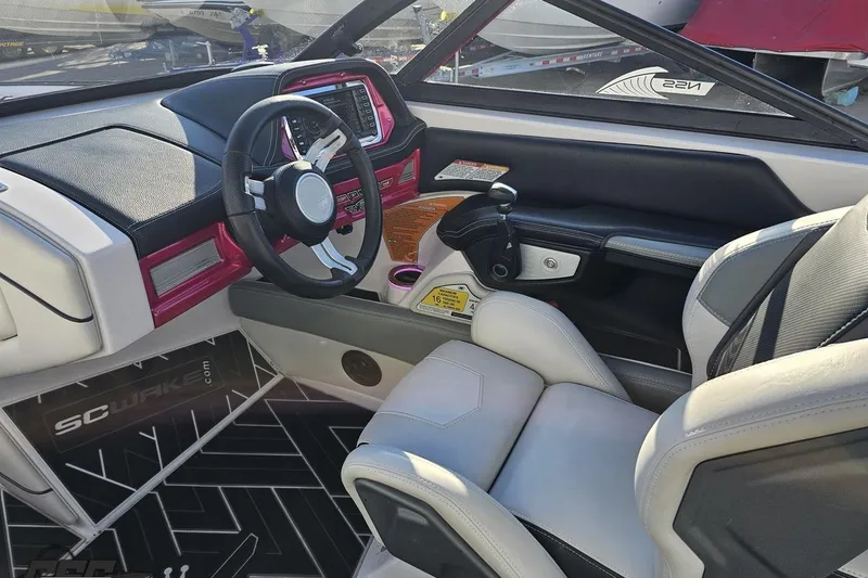Slide: The Image of 2015 Nautique Super Air Nautique G23 interior with steering wheel and dashboard controls. - 84
