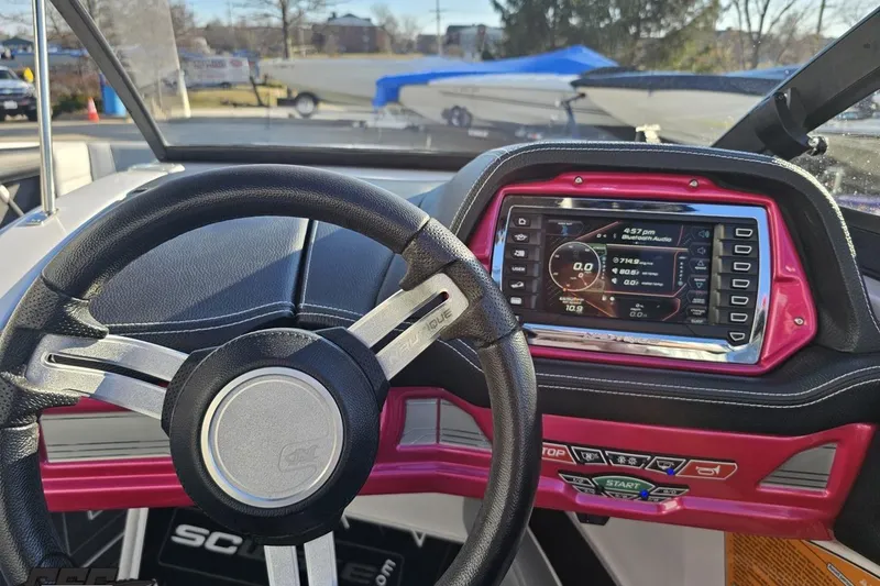 Slide: The Image of Steering wheel and dashboard of 2015 Nautique Super Air Nautique G23 boat. - 87