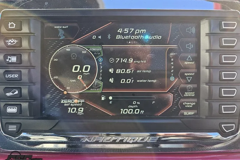 Slide: The Image of Dashboard of 2015 Nautique Super Air Nautique G23 with digital controls and display. - 89