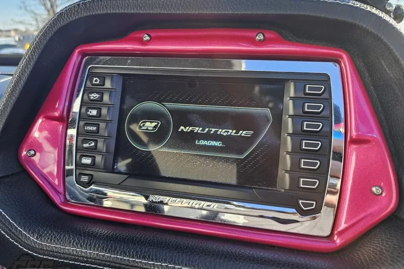 Slide: The Image of 2015 Nautique Super Air Nautique G23 dashboard display with control buttons. - 91