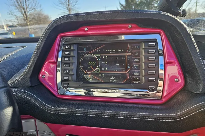 Slide: The Image of 2015 Nautique Super Air Nautique G23 dashboard with touchscreen display and controls. - 92