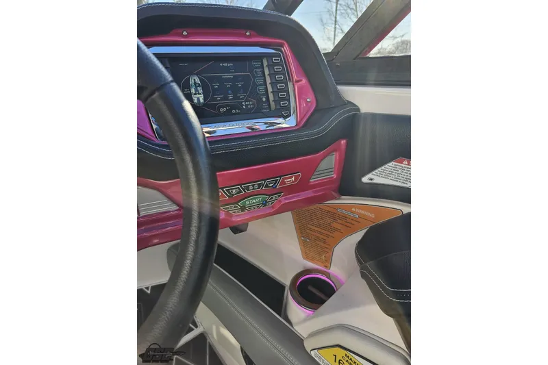 Slide: The Image of 2015 Nautique Super Air Nautique G23 dashboard with touchscreen and controls. - 94