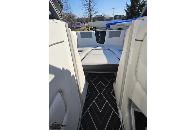 Slide: The Image of 2015 Nautique Super Air Nautique G23 interior with white seating and patterned flooring. - 97