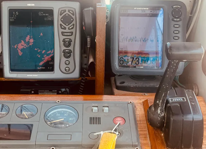 Slide: The Image of 1974 Dyer 29' Sport Fisher dashboard with marine radar and navigation equipment. - 21