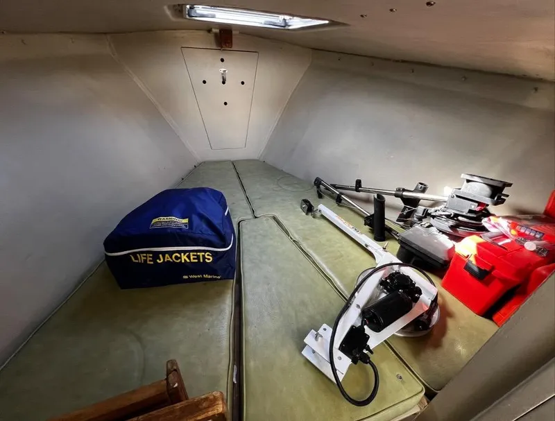 Slide: The Image of 1974 Dyer 29' Sport Fisher cabin with life jackets and equipment storage. - 29