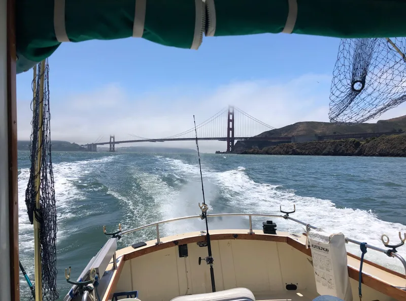 Slide: The Image of 1974 Dyer 29' Sport Fisher cruising near Golden Gate Bridge, scenic view. - 9