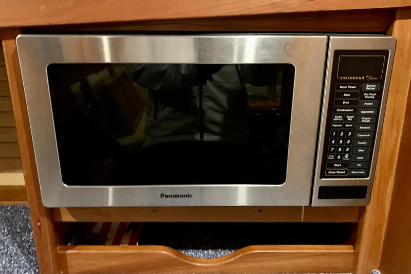 Slide: The Image of Panasonic microwave in 2006 Sabre 38 Hard Top Express boat kitchen. - 20