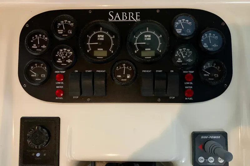 Slide: The Image of Control panel of 2006 Sabre 38 Hard Top Express with gauges and switches. - 30