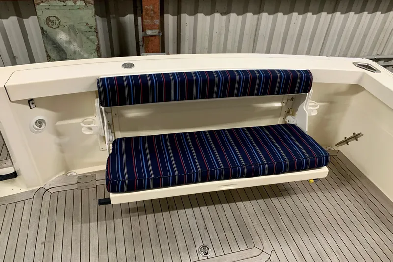 Slide: The Image of 2006 Sabre 38 Hard Top Express boat with striped bench seating. - 43