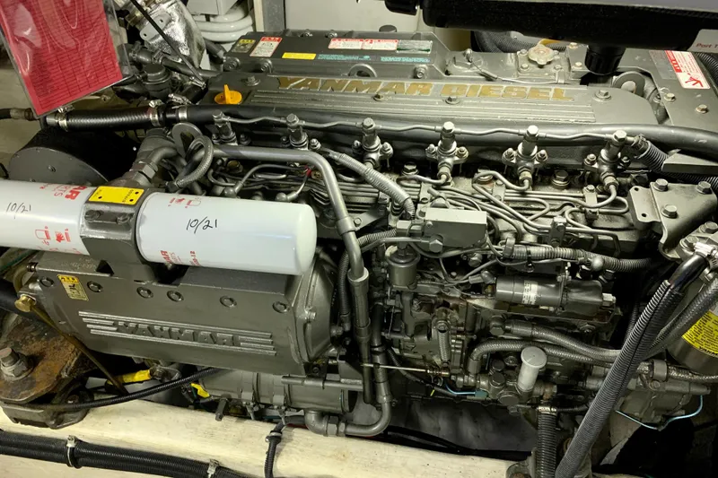 Slide: The Image of Engine of a 2006 Sabre 38 Hard Top Express boat, featuring Yanmar diesel components. - 49