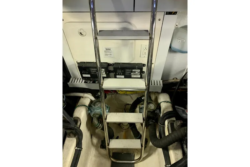 Slide: The Image of Engine room of 2006 Sabre 38 Hard Top Express with ladder and equipment. - 52