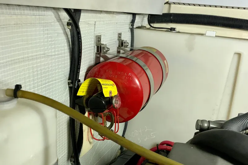 Slide: The Image of Fire extinguisher in 2006 Sabre 38 Hard Top Express engine compartment. - 54