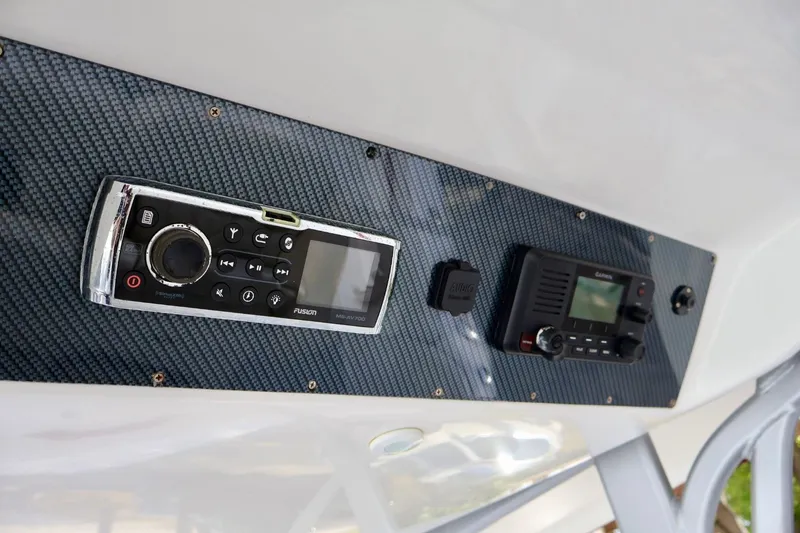 Slide: The Image of Control panel of 2015 Deep Impact 33 boat with audio and navigation systems. - 15