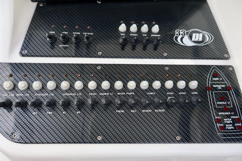 Slide: The Image of Control panel of a 2015 Deep Impact 33 boat with carbon fiber finish. - 16