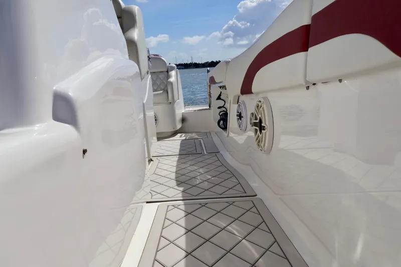 Slide: The Image of 2015 Deep Impact 33 boat deck with red accents and marine speaker. - 7
