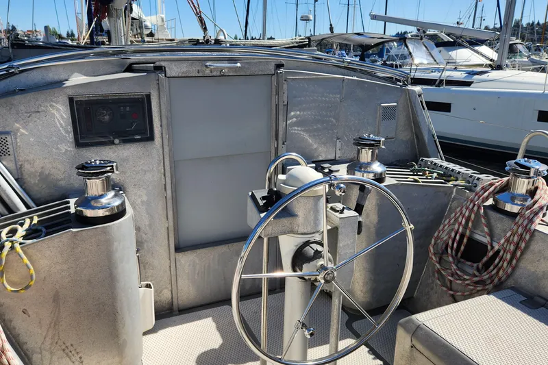 Slide: The Image of Steering wheel of 2004 Dudley Dix Jacobs Bros 43 Pilot yacht in marina. - 16