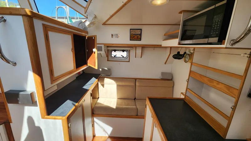 Slide: The Image of Interior of 2004 Dudley Dix Jacobs Bros 43 Pilot yacht with modern kitchen and seating area. - 33
