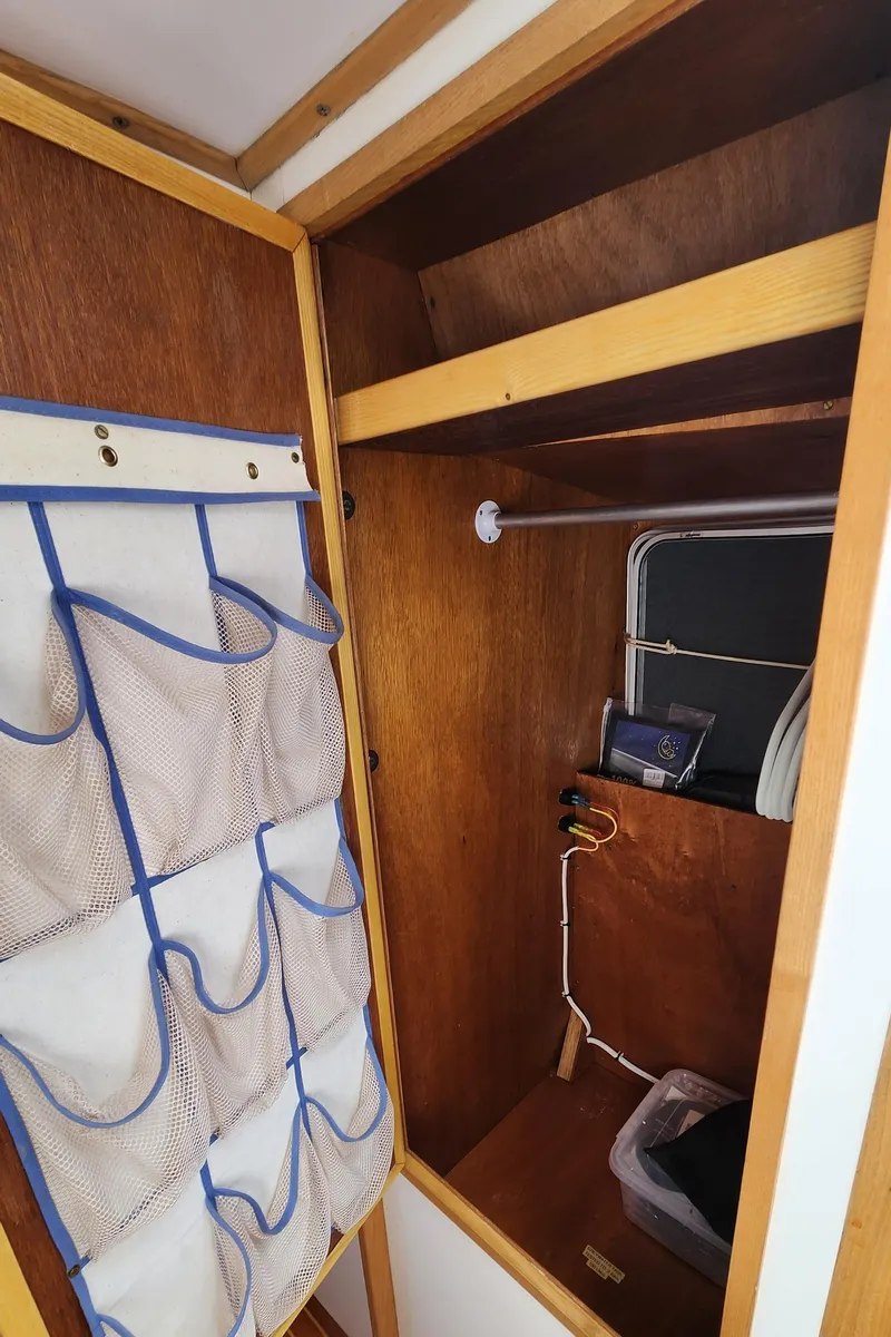 Slide: The Image of Wooden interior of 2004 Dudley Dix Jacobs Bros 43 Pilot with storage and hanging space. - 44